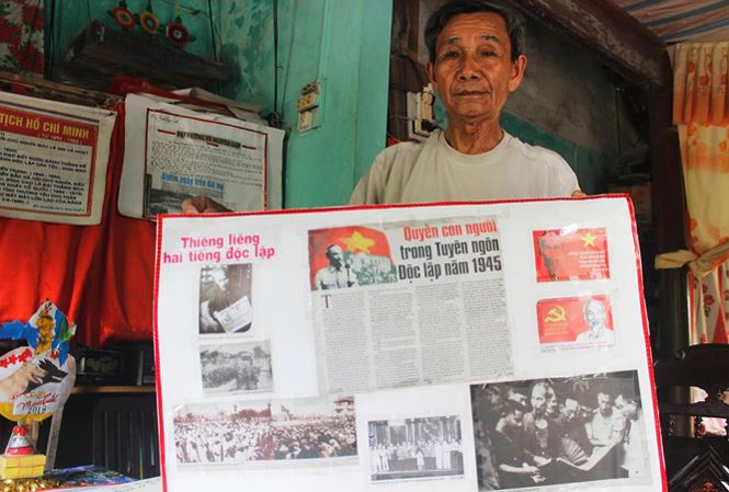 Cựu binh Nguyễn Quang Huy bên những bức ảnh